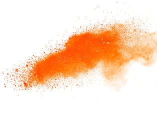Abstract orange powder explosion isolated on white background.