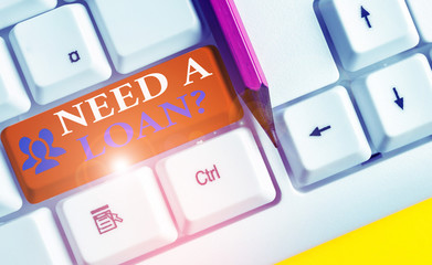 Writing note showing Need A Loan question. Business concept for amount of money that is borrowed...