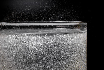 Fizz sparkling water Refreshing bubbly Soda Pop with Ice Cubes. Cold soft drink carbonated liquid...