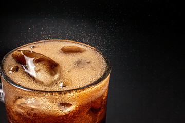 Fizz sparkling Cola water Refreshing bubbly Soda Pop with Ice Cubes. Cold soft drink cola carbonated liquid fresh and cool iced drink in a glasses . Refreshing and quench thirst concept .