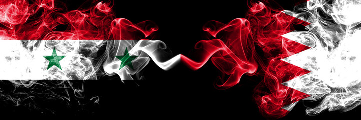 Syria vs Bahrain, Bahrani smoke flags placed side by side. Thick colored silky smoke flags of Syrian and Bahrain, Bahrani