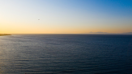 aeroplane flying over ocean
