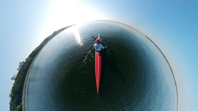 Round view of a person canoeing along the river