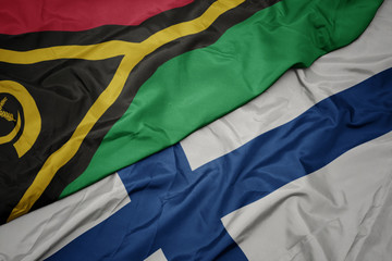 waving colorful flag of finland and national flag of Vanuatu .