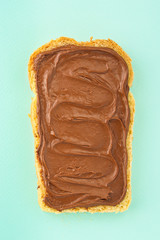 chocolate nut butter sandwich (delicious snack, bread or toast and nut butter, paste, classic combination of taste, Italian cuisine) menu concept. food background. copy space. Top view