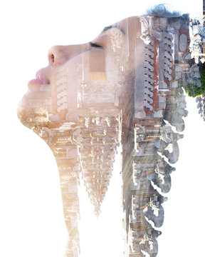 Double exposure portrait of a young traveller with long wavy hair combined with an unusual upside down photograph of a temple in southeast asia