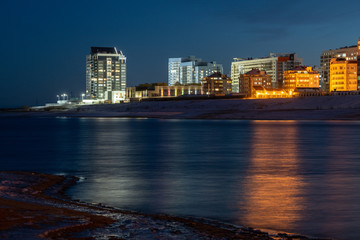 The architecture of the new district of the Yakutsk city, Sakha Republic/Russia. Night panorama of the city with the Lena River