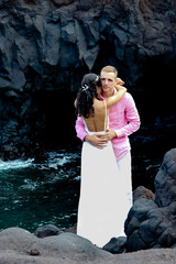 Happy couple just married at the oceanside