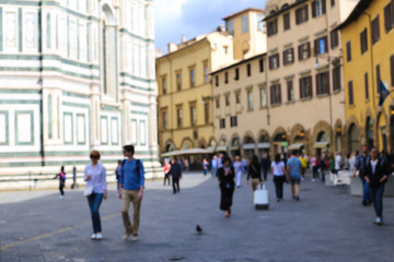 Blurred image of tourists and croud street near Florence Cathedral, Italy.