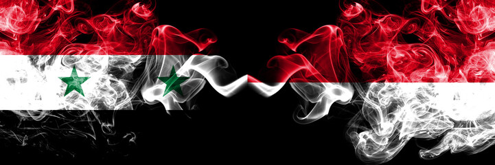Syria vs Monaco, Monacan smoke flags placed side by side. Thick colored silky smoke flags of Syrian and Monaco, Monacan