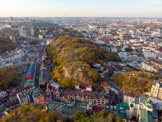 Aerial top view of Kyiv cityscape of Vozdvizhenka and Podol historical districts on sunset from above, city of Kiev, Ukraine