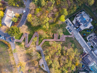Aerial top view of Kyiv cityscape of Vozdvizhenka and Podol historical districts on sunset from above, city of Kiev, Ukraine