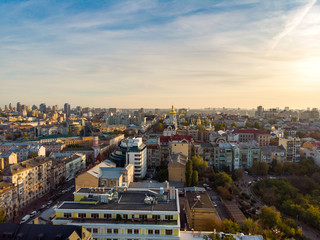 Aerial top view of Kyiv cityscape, Dnieper river and Podol historical district skyline from above, Kontraktova square with ferris wheel, city of Kiev, Ukraine