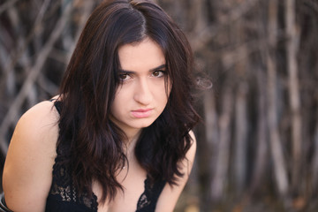 Portrait of glamour brunette model on autumn landscape background