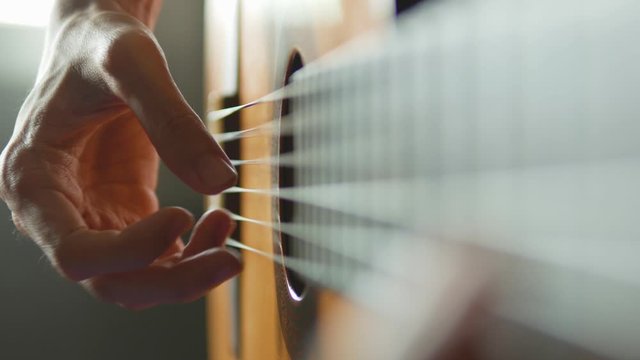 Man playing fingerstyle classical guitar