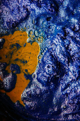 Fototapeta premium Thai traditional fabric process. Close Up of Indigo plant fermentation. Natural dyeing fabric with indigo water. Manufacture of natural dyeing color. Indigo background