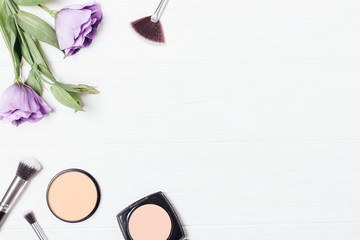 Flat lay composition of female decorative cosmetics powders