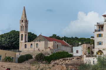 Fototapeta na wymiar St. George Church, a Greek-Orthodox church, located near the southern entrance to Old Jaffa, and is known for its tall bell tower.