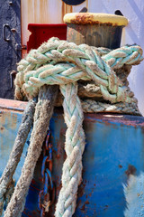 Close up of a shipping bollard with rope
