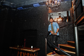 Portrait of handsome successful bearded south asian, young indian freelancer in blue jeans shirt...