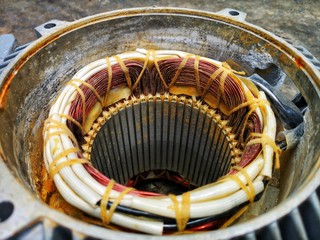 Close up of copper coil wire in electrical motor stator.Concept for repair and...