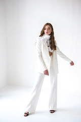portrait of young woman in white suit