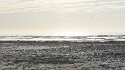 Waves on beach. Beach sunrise. Morning on the beach. Sunrise on the beach. Sand. Sand with sunrise. 