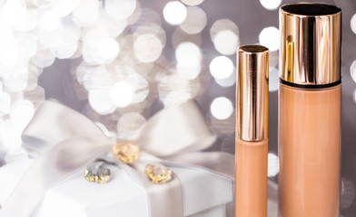 Holiday make-up foundation base, concealer and white gift box, luxury cosmetics present and blank...
