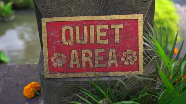 Slowmotion closeup shot of the Quet area sign in a tropical spa