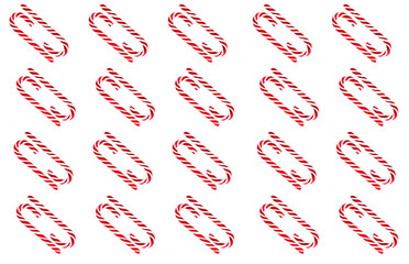 Christmas candy cane pattern on white background. Flat lay and top view
