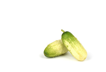 Two organic small cucumbers isolated on white background.