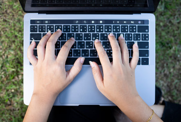 The woman's hand on the laptop