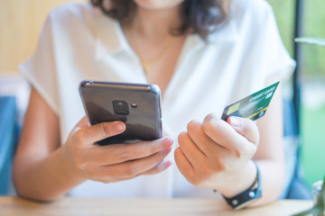 Online shopping with smartphone and shopping bags delivery service using as background shopping concept and delivery service concept with copy space  for your text or  design.