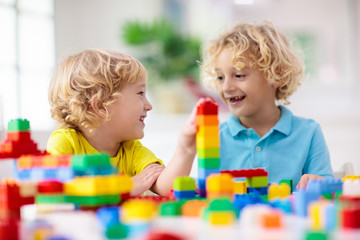 Obraz na płótnie Canvas Child playing with toy blocks. Toys for kids.