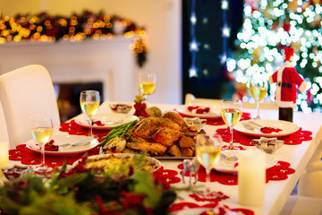 Christmas dinner at fire place and Xmas tree.