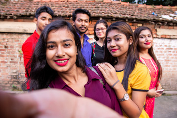 Best friends multiracial people taking selfie outdoor - Happy friendship concept with young...