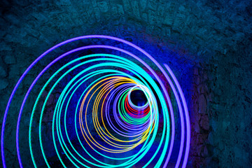 Spiral of colored light made in total darkness with a flashlight. Lightpainting technique