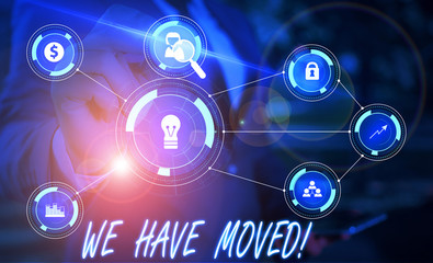Writing note showing We Have Moved. Business concept for To go from one residence or location to another Relocate Male wear formal suit presenting presentation smart device
