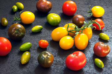 Assortment of colorful fresh vegetables on black background