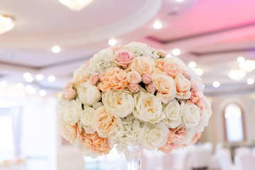 Trendy flower decor for a classic wedding in the restaurant 's banquet hall.