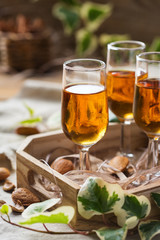 Italian almond liquor amaretto on a wooden table