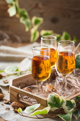 Italian almond liquor amaretto on a wooden table