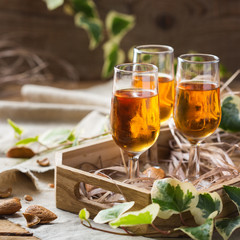 Italian almond liquor amaretto on a wooden table
