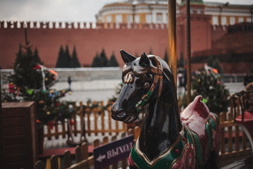 Fototapeta na wymiar Children's carousel at the New Year's fair in Moscow, winter
