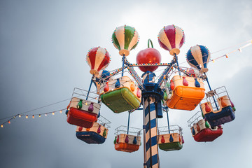 Fototapeta na wymiar Children's carousel at the New Year's fair in Moscow, winter 2018