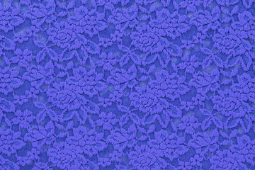 Background in the form of knitted material with a floral pattern in blue