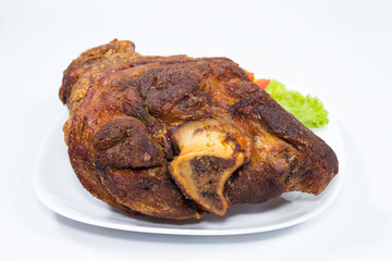 fried pork leg cooked on background
