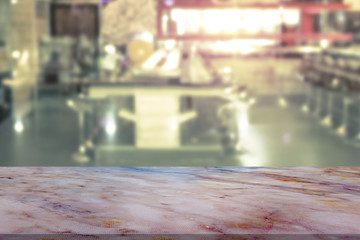 Marble table with restaurant blur background