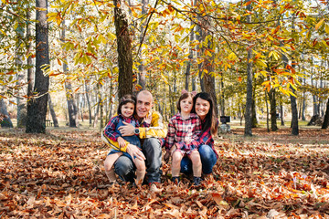 Fototapeta premium Family at park in autumn