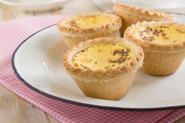 British egg custard tarts sprinkled with nutmeg
